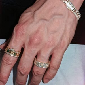 Crown ring with emeralds and crystal eternity band paired with Cuban link bracelet