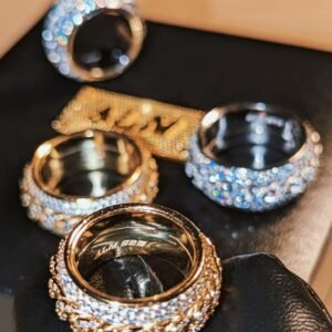 Gold-plated Cuban link spinner rings with pavé stones