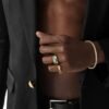 Gold rings and tennis bracelet styled with formal black attire