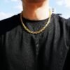 Gold gridlock chain necklace styled with black t-shirt