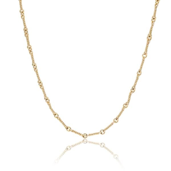 Gold dog bone link chain necklace against white background