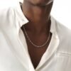 White gold dog bone link chain necklace styled with white dress shirt