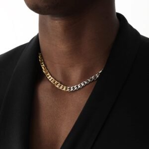 Two-tone metal chain necklace worn with black blazer