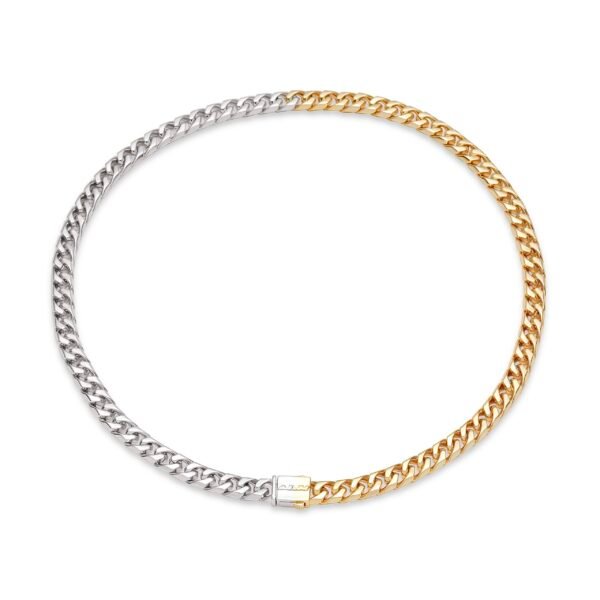 Half silver, half gold curb chain necklace with center box clasp on white background