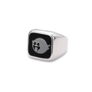 Detailed view of silver signet ring with black enamel ghost design on white background