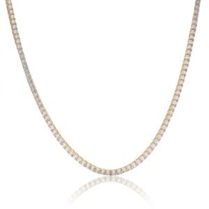 Gold plated sterling silver tennis chain with cubic zirconia stones on white background with reflection