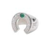 Sterling silver horseshoe ring with emerald accent viewed from angle