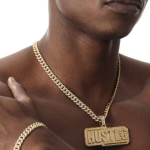 Model wearing gold HUSTLE pendant with matching cubic zirconia Cuban chain and bracelet set