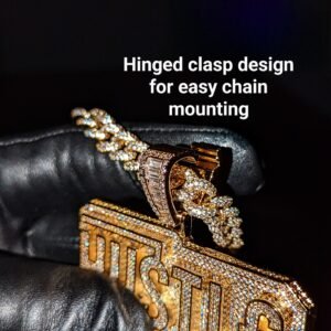 Gold HUSTLE pendant with diamond-studded design featuring innovative hinged clasp mounting system