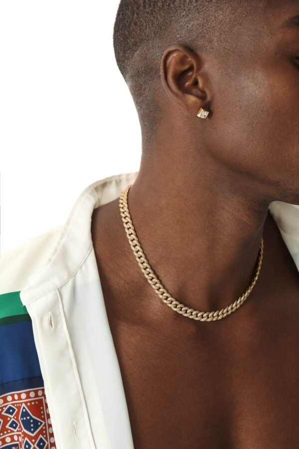 Gold and diamond cuban link chain with matching stud earring, styled with patterned white shirt