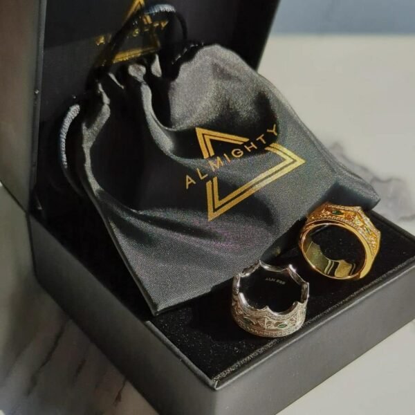 Gold and silver Majesty crown rings displayed in black box with Almighty jewelry pouch and branding