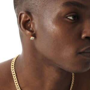 Side profile portrait featuring gold pyramid stud earring and Cuban chain necklace