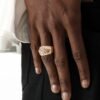 Rose gold eagle ring with crystal accent on dark skin tone