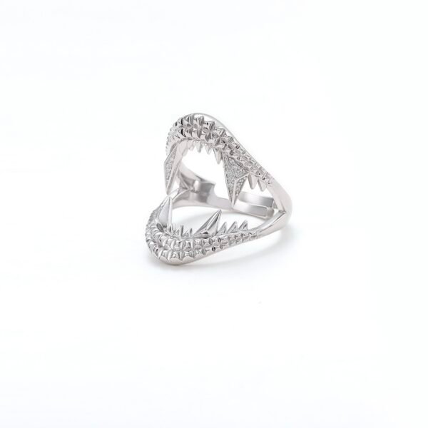 Polished sterling silver shark jaw ring with textured detail and diamond accents shown at three-quarter angle