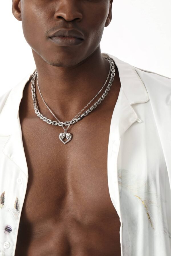 Silver skull heart pendant and diamond gridlock chain styled with white shirt Filename: skull-heart-gridlock-styling