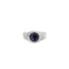 Silver tiger ring with deep blue sapphire center stone shown face-forward on white background